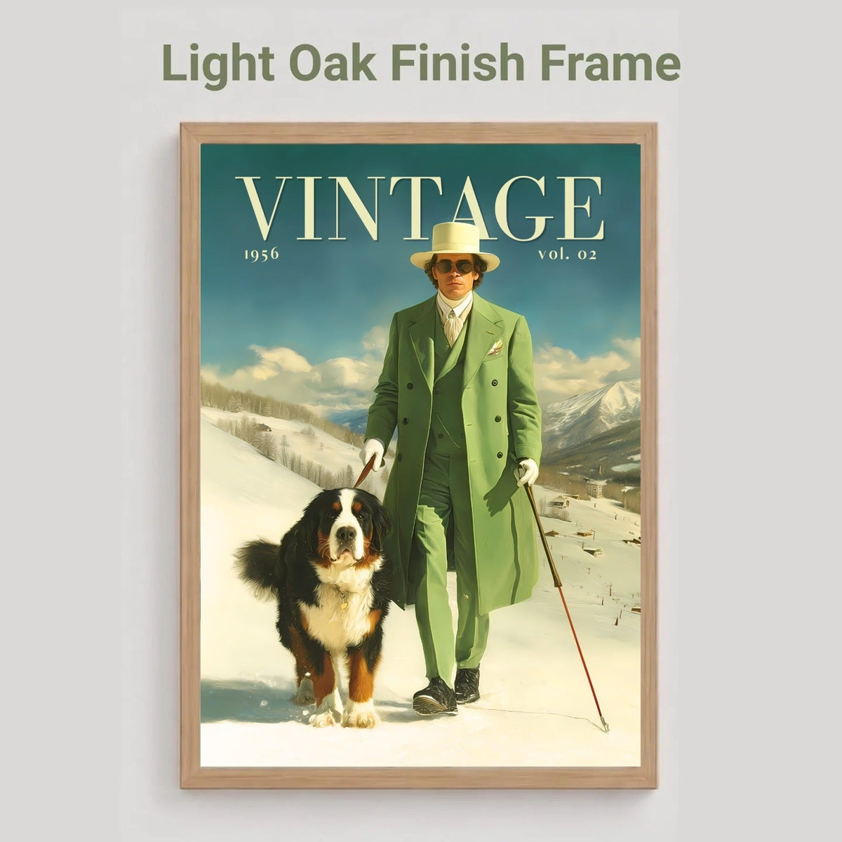 A framed vintage-style poster on a light gray background, with the text 'Light Oak Finish Frame' above it. The poster shows a man in a green coat walking a Bernese mountain dog in a snowy landscape under a blue sky, with the word 'VINTAGE' across the top.