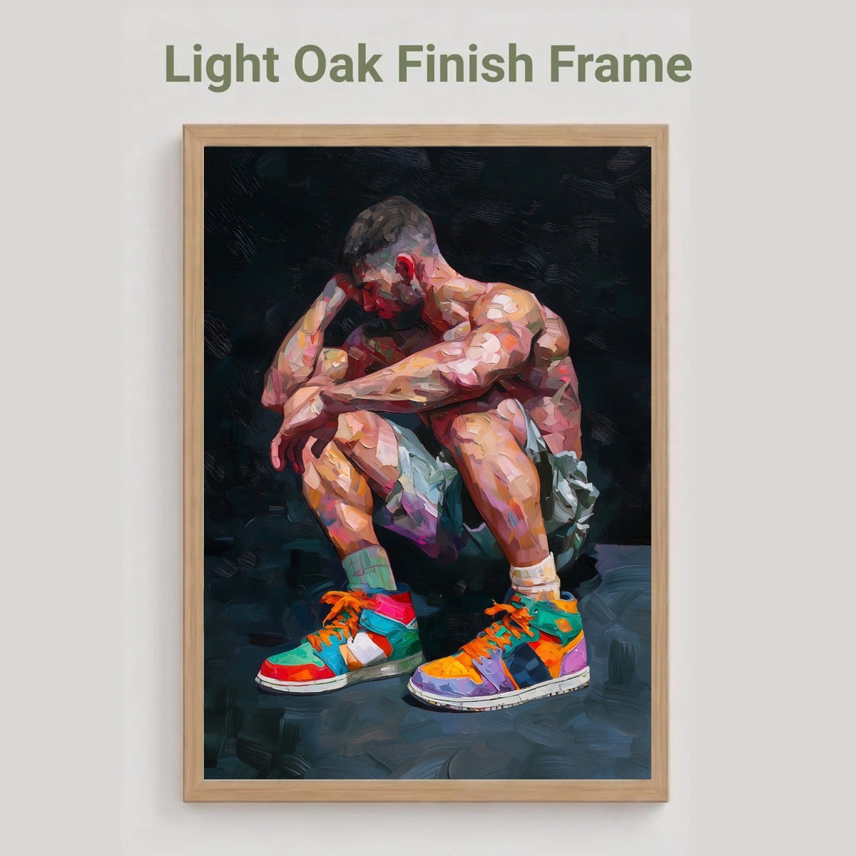 Pause gay art print in the light oak finish frame option, a muscular man crouching in colourful high-top trainers, labelled Light Oak Finish Frame