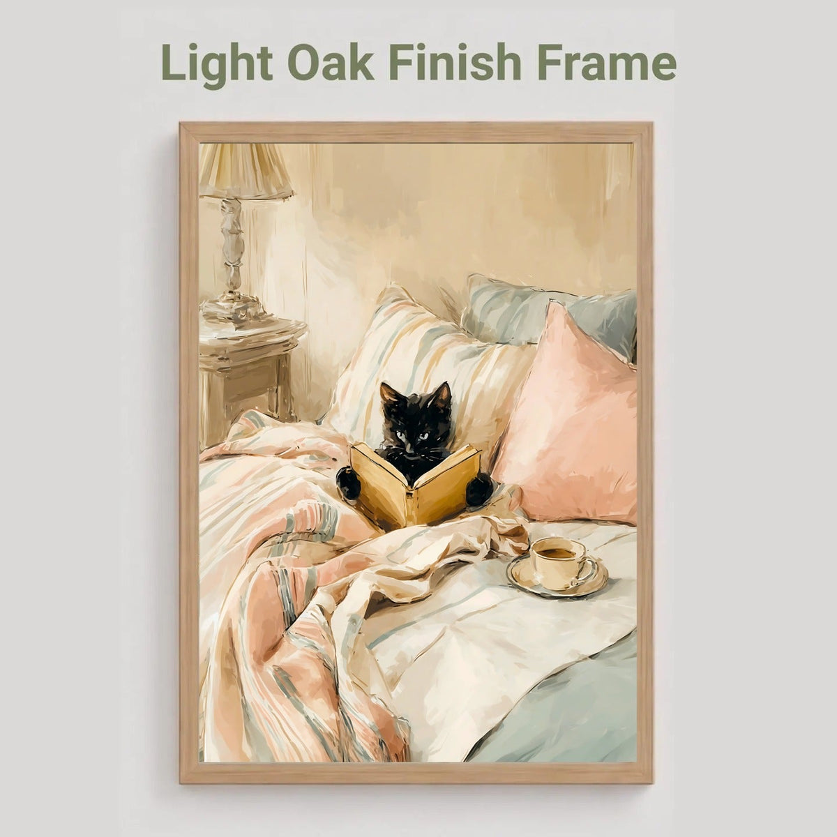 Light oak finish frame option showing the black cat reading a book in bed print in blush pink and cream tones.
