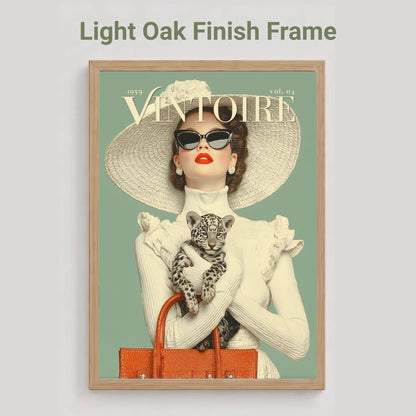 A framed art print featuring a vintage-style Vogue cover illustration of a woman in a large straw hat holding a leopard, with the text 'Light Oak Finish Frame' above it on a light gray background.