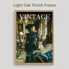 A framed vintage magazine cover featuring a woman in a dark dress and hat beside a leopard, displayed against a light gray background with the text 'Light Oak Finish Frame' above it.
