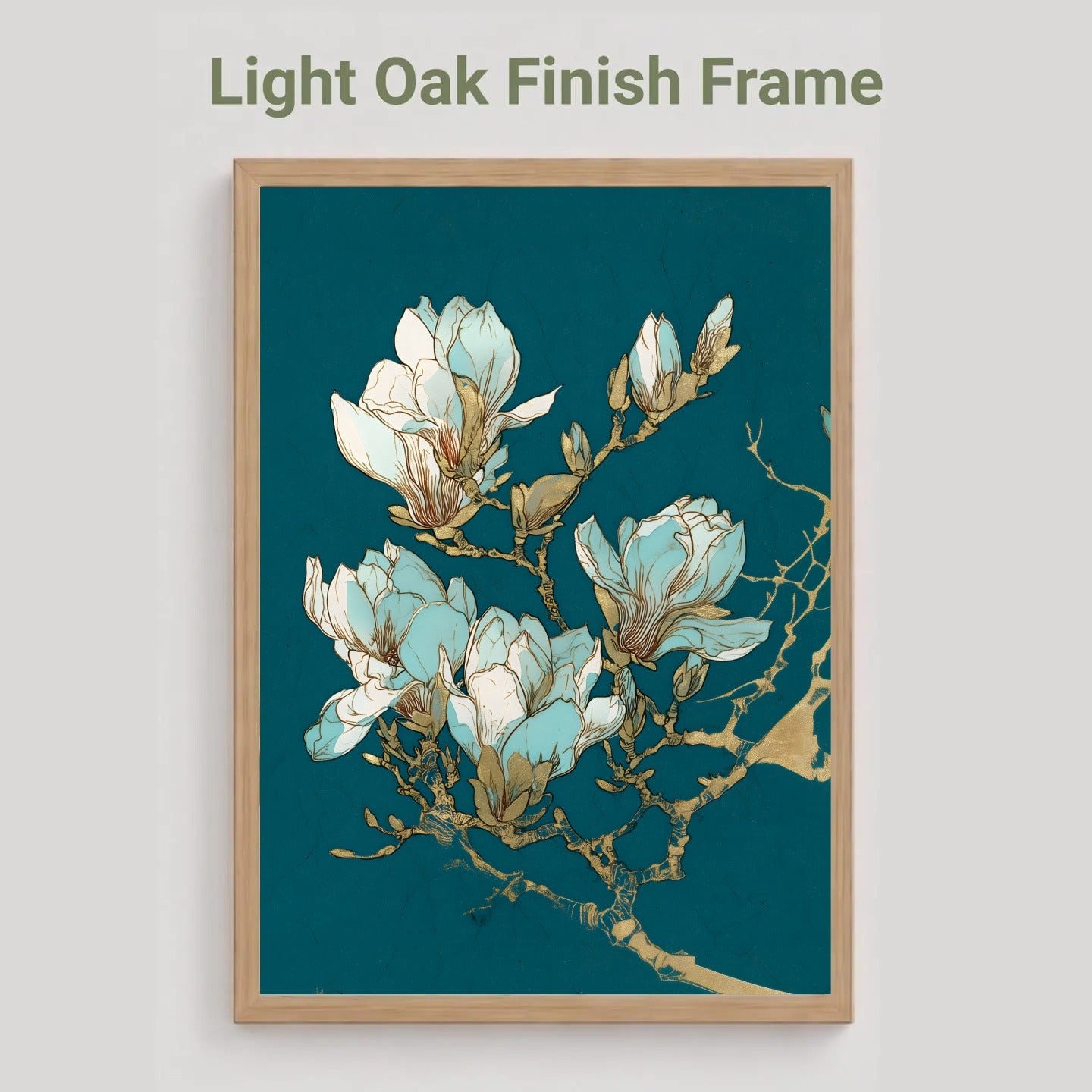 A framed art print featuring light blue and white magnolia blossoms on a dark teal background, enclosed in a light oak finish frame. The text 'Light Oak Finish Frame' is displayed above the frame against a neutral light gray background.