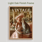 A framed art print featuring a vintage fashion magazine cover with a woman in a pink gown and hat sitting beside a leopard, displayed on a light gray background with the text 'Light Oak Finish Frame' above it.