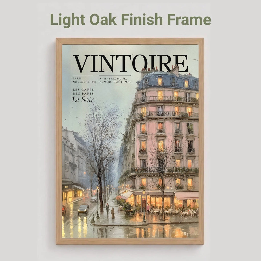 A framed art print featuring a vintage Parisian street scene with the title 'VINTOIRE' on the cover, displayed in a light oak finish frame against a neutral gray background with the text 'Light Oak Finish Frame' above it.