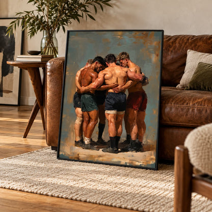 A framed vertical canvas print of four shirtless men huddled together in athletic shorts, leaning against a brown leather sofa in a styled living room setting.