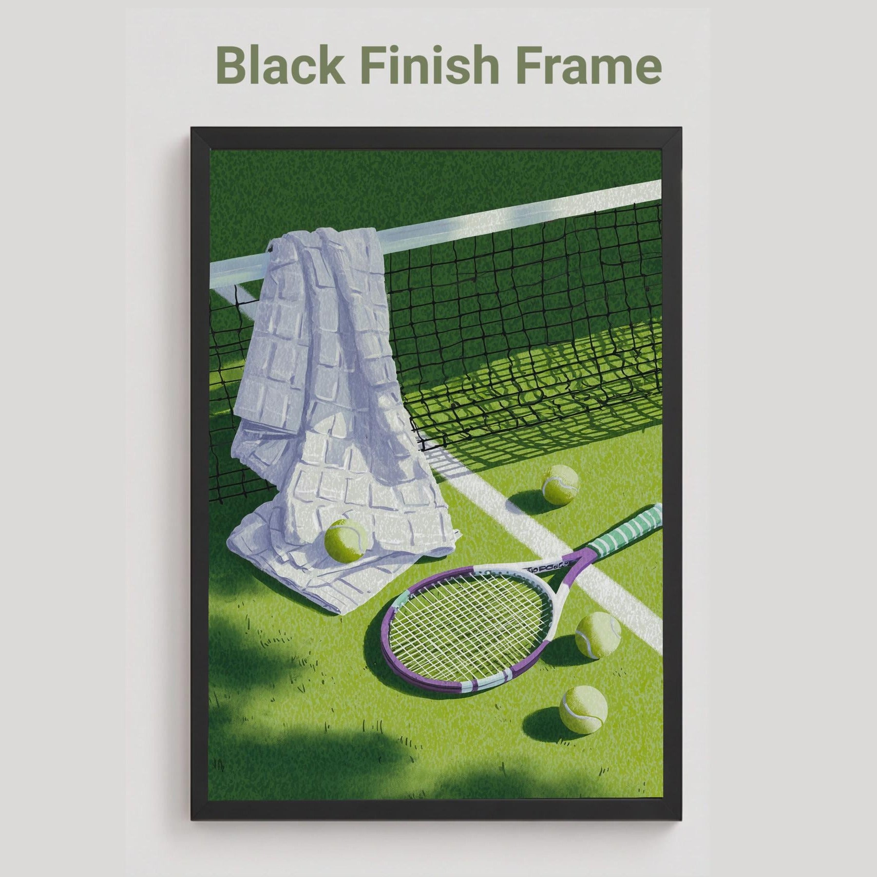 A black finish framed tennis-themed art print on a light gray background. The print shows a green tennis court with a white towel draped over the net, tennis balls, and a racket. Vintage tennis racket, towel and balls resting on a grass court, retro lilac and sage tennis wall art print