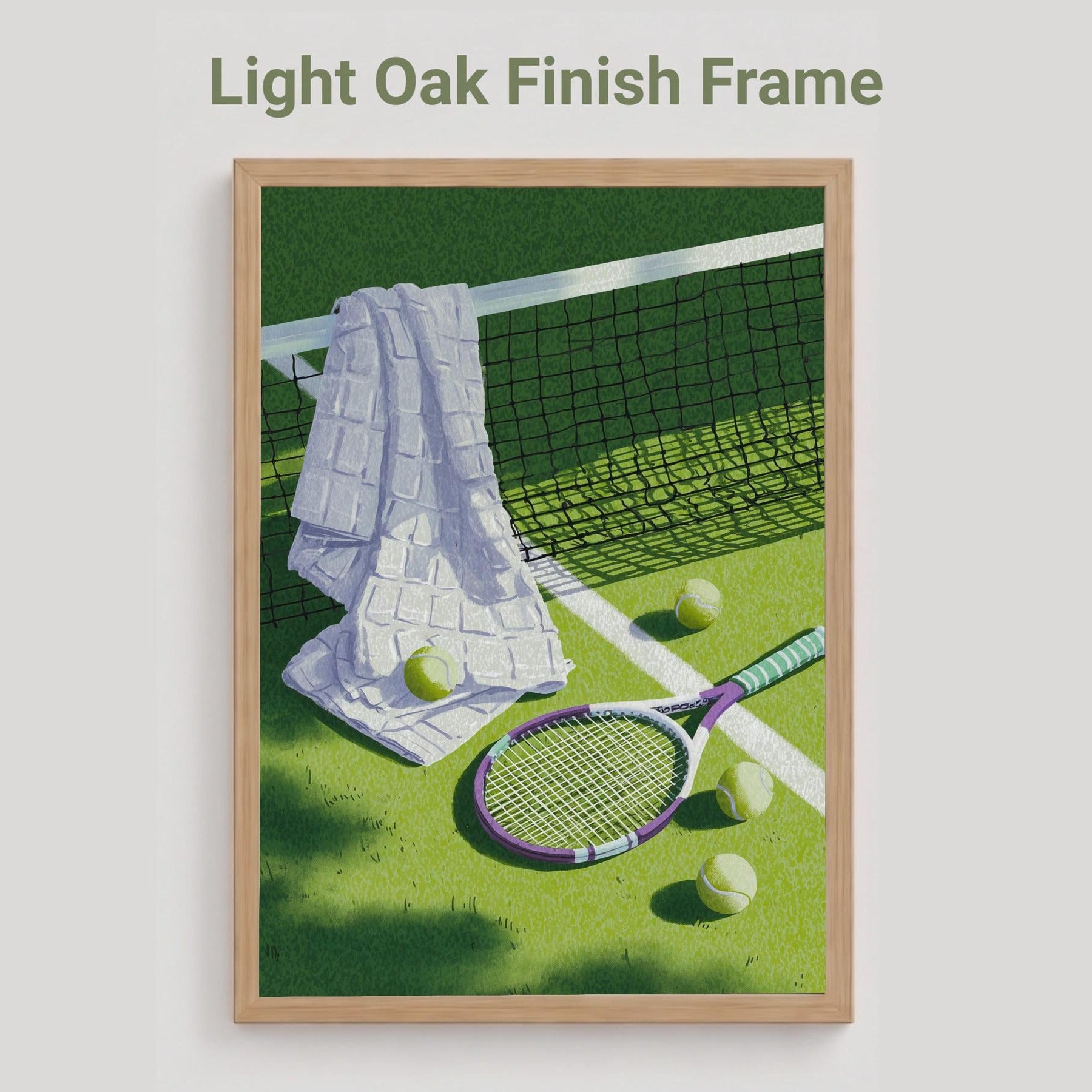 An oak finish framed art print featuring a tennis court scene with a white towel, tennis balls, and a racket on a green court, displayed on a light gray background with the text 'Light Oak Finish Frame' above it.