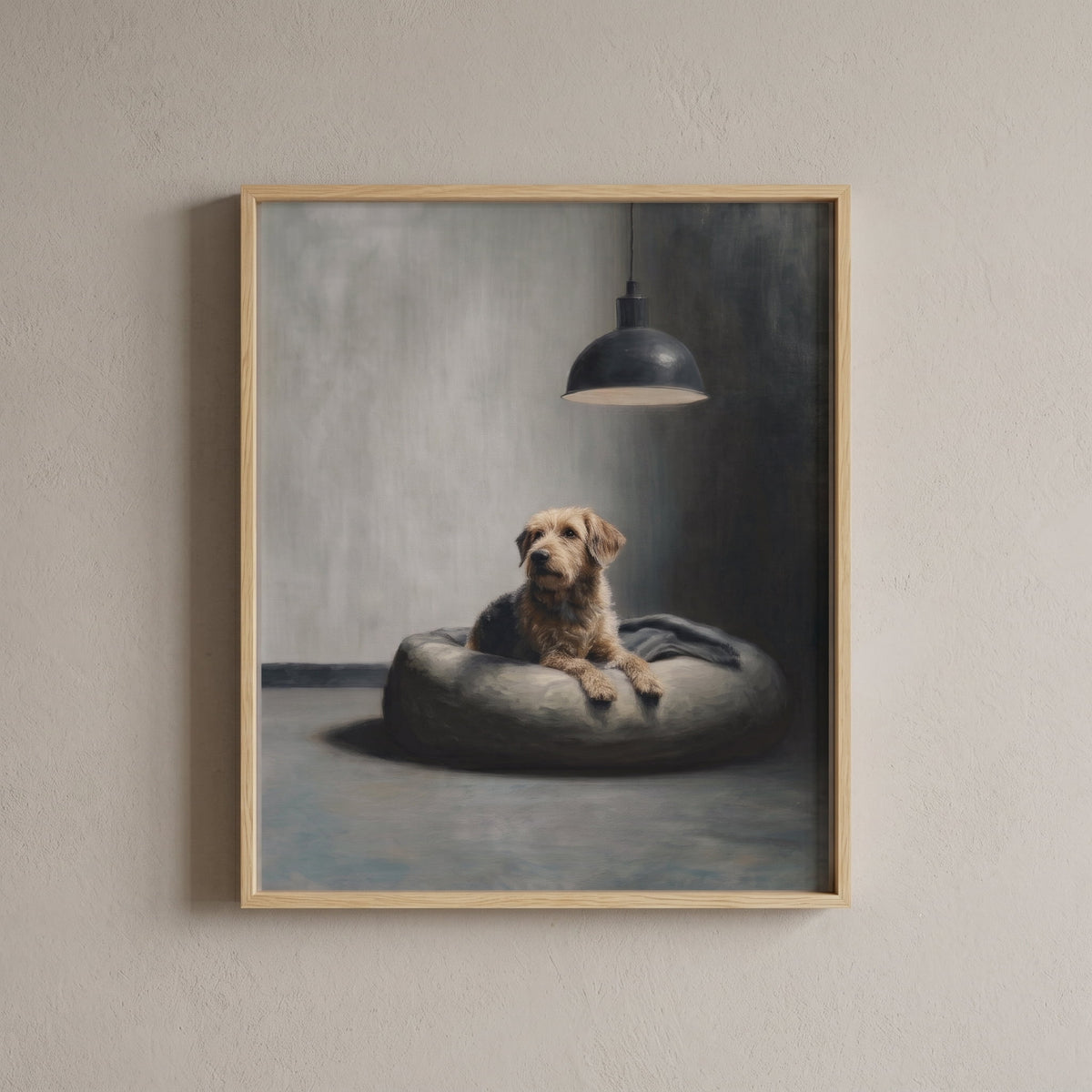 A framed art print featuring a dog lying on a round cushion under a hanging lamp, hung on a light beige textured wall.