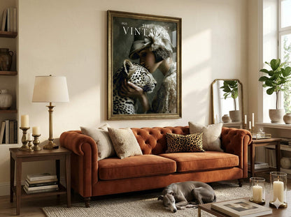 Living room with brown sofa, decorative pillows, and a framed magazine cover on the wall. Vintage magazine cover art print featuring a 1920s woman in a lace hat caressing a leopard for moody retro apartment decor and bar cart wall art, Flapper, Downtown Abbey, Great Gatsby.