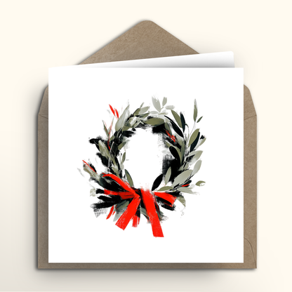 Greeting card with a festive wreath design on a white background