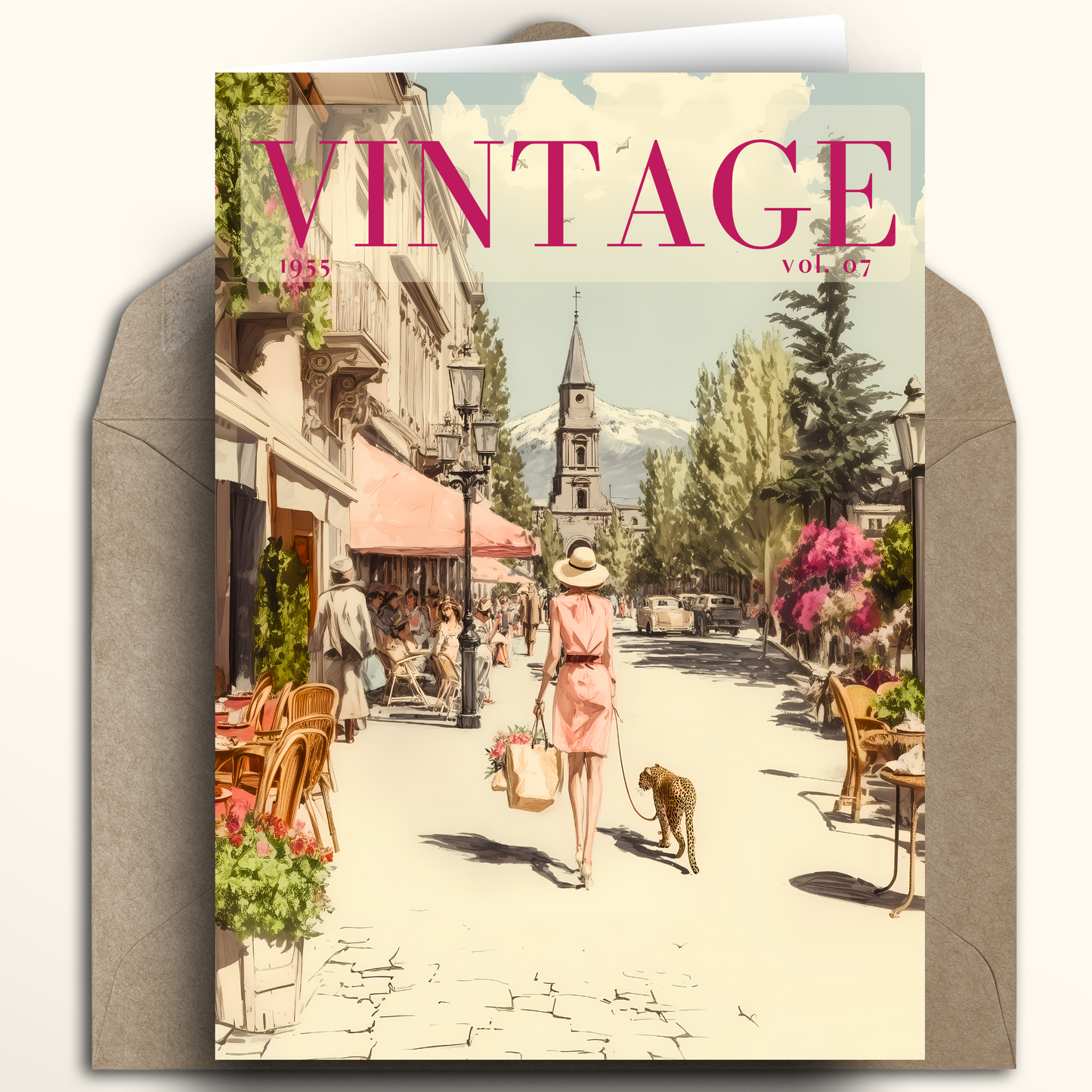 A vintage-style illustrated greeting card or magazine cover titled "VINTAGE" is shown standing in front of a brown envelope. The artwork depicts a sunlit street scene with a woman walking a dog, café seating, trees, and a church spire in the distance.