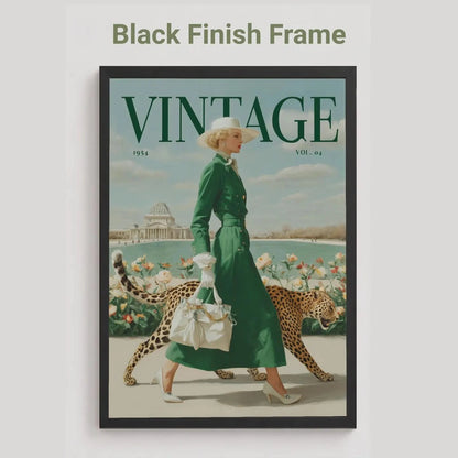 A framed vintage-style magazine cover art piece on a light gray background, with the text 'Black Finish Frame' above it. The artwork shows a woman in a green dress walking with a leopard, under a large 'VINTAGE' title, and the frame itself is black.