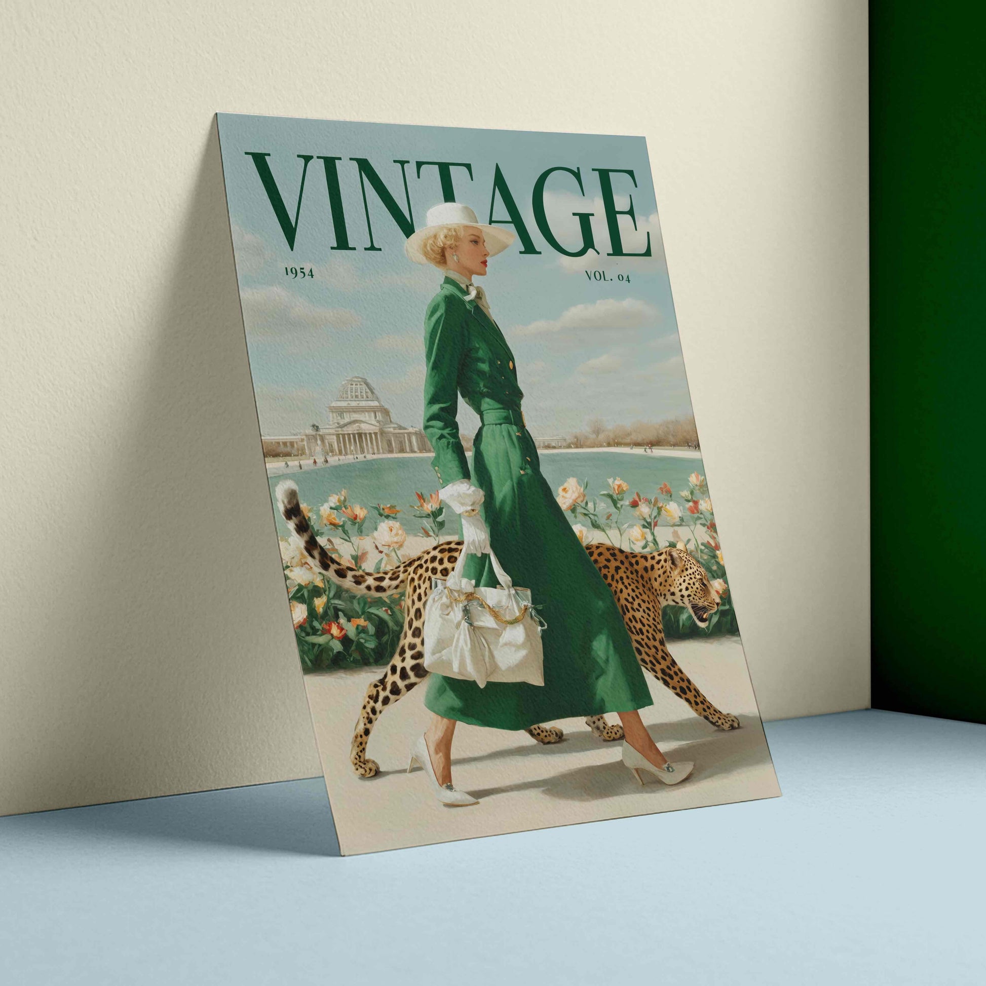 A vintage-style illustrated poster or print leaning against a wall on a light blue surface. The artwork shows a woman in a long green dress walking with two cheetahs near water and flowers, with the large word 'VINTAGE' across the top.