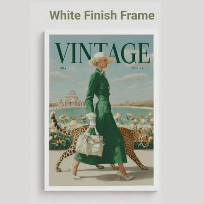 A vintage-style framed poster featuring a woman in a green dress walking with two cheetahs, with the word VINTAGE prominently printed at the top. The frame is white, and the image is shown against a light gray background with the text 'White Finish Frame' above it.