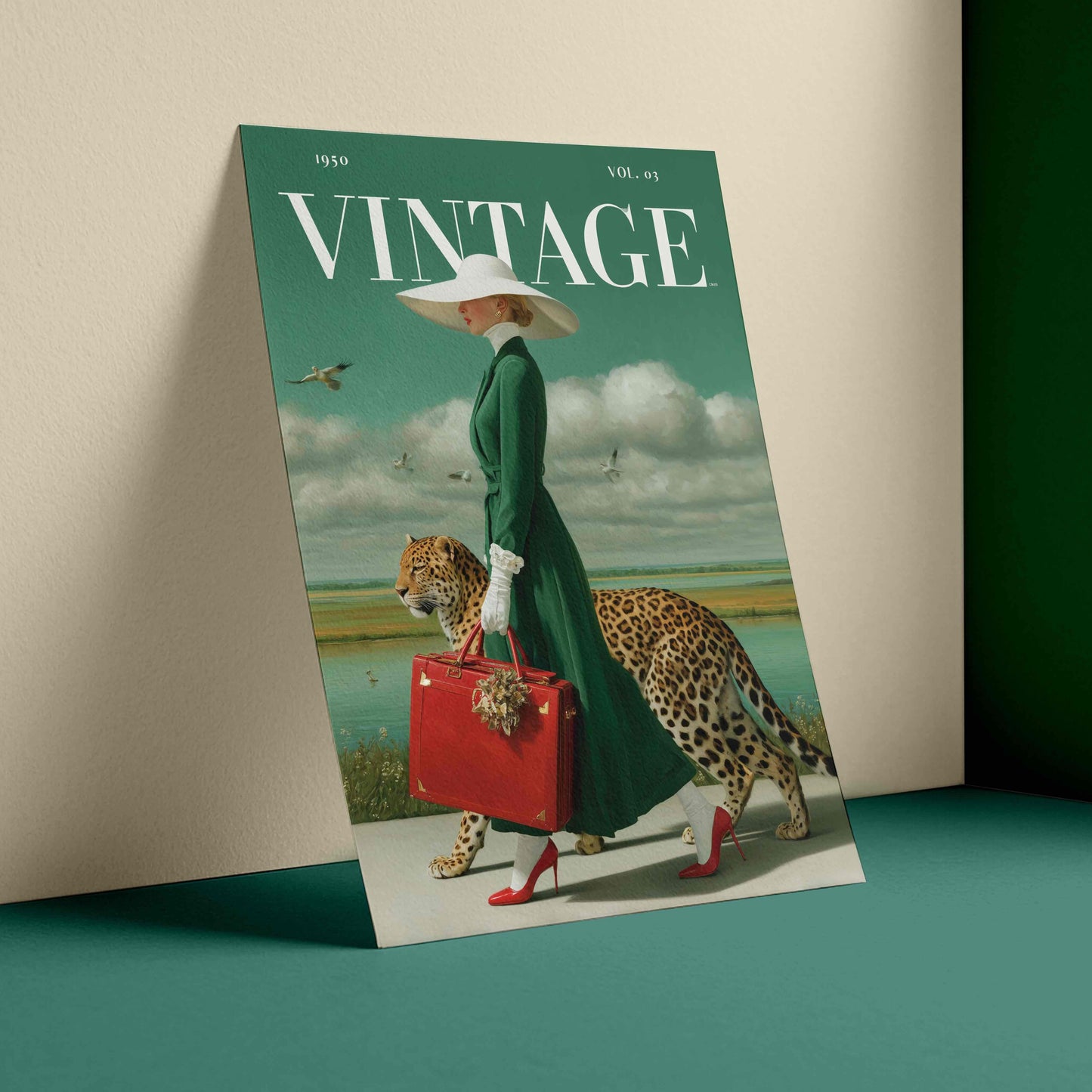 A vintage-style illustrated magazine or poster cover titled VINTAGE, leaning against a beige wall on a teal surface. The cover art shows a woman in a long green dress and white hat carrying a red suitcase, accompanied by a leopard, with a landscape and birds in the background.
