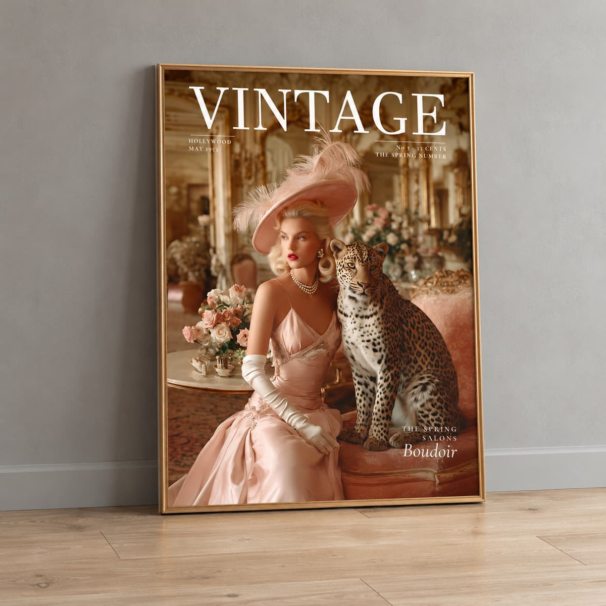 A framed vintage-style art print leaning against a gray wall on a light wood floor. The print features a woman in a pale pink satin gown and large feathered hat seated beside a spotted leopard in an ornate interior, with the word 'VINTAGE' across the top.