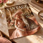 A styled flat-lay of a vintage magazine titled VINTAGE, featuring a cover photo of a woman in a pink gown and hat with a leopard, placed on a marble surface with books and flowers around it.
