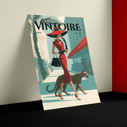 A vintage-style illustrated magazine cover titled VINTOIRE, shown leaning against a wall in a room corner. The cover features a woman in a red dress and large red hat walking beside a leopard, with teal, cream, and red illustration colors.