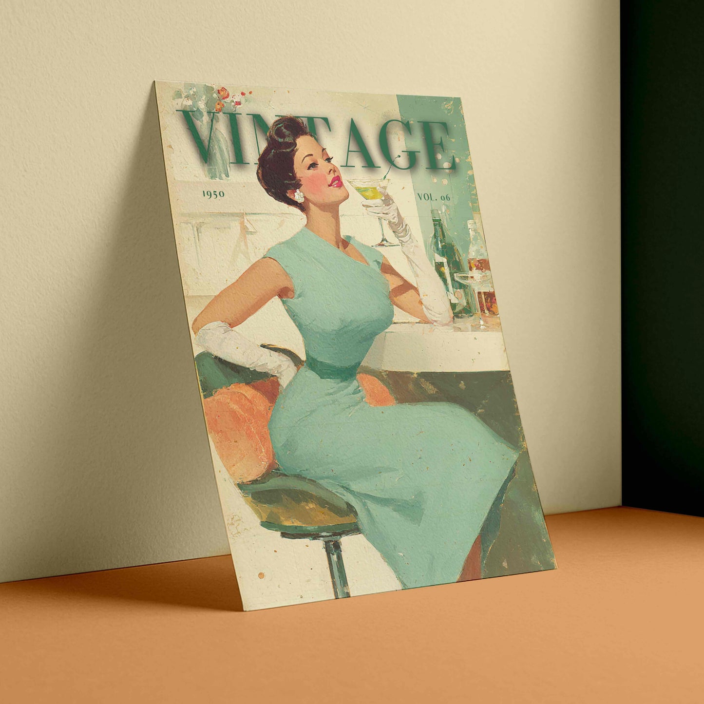 A vintage-style illustrated poster or print leaning against a wall on a peach-colored surface. The artwork shows a seated woman in a light blue dress with the word "VINTAGE" across the top, rendered in muted retro tones.