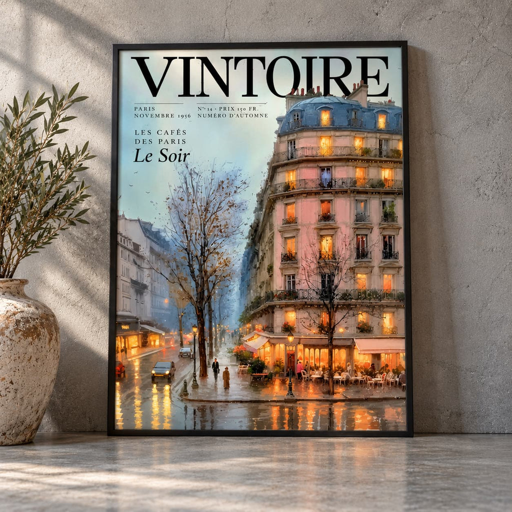 Black-framed Vintoire Rainy Paris café poster leaning against a grey plaster wall in soft window light, next to an olive tree in a stone urn.