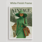 A vintage-style magazine cover framed in white, titled 'VINTAGE vol. 01,' showing a woman in a green hat and coat standing in snow beside a leopard.
