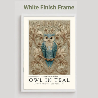 A framed art print featuring a blue owl perched on a branch with ornate beige foliage, shown against a light gray background. The top of the image includes the text 'White Finish Frame' above the frame.