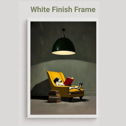 A framed art print featuring a cozy scene of a dog reading a red book in a yellow armchair under a hanging lamp, with the text 'White Finish Frame' above the print on a light gray background.