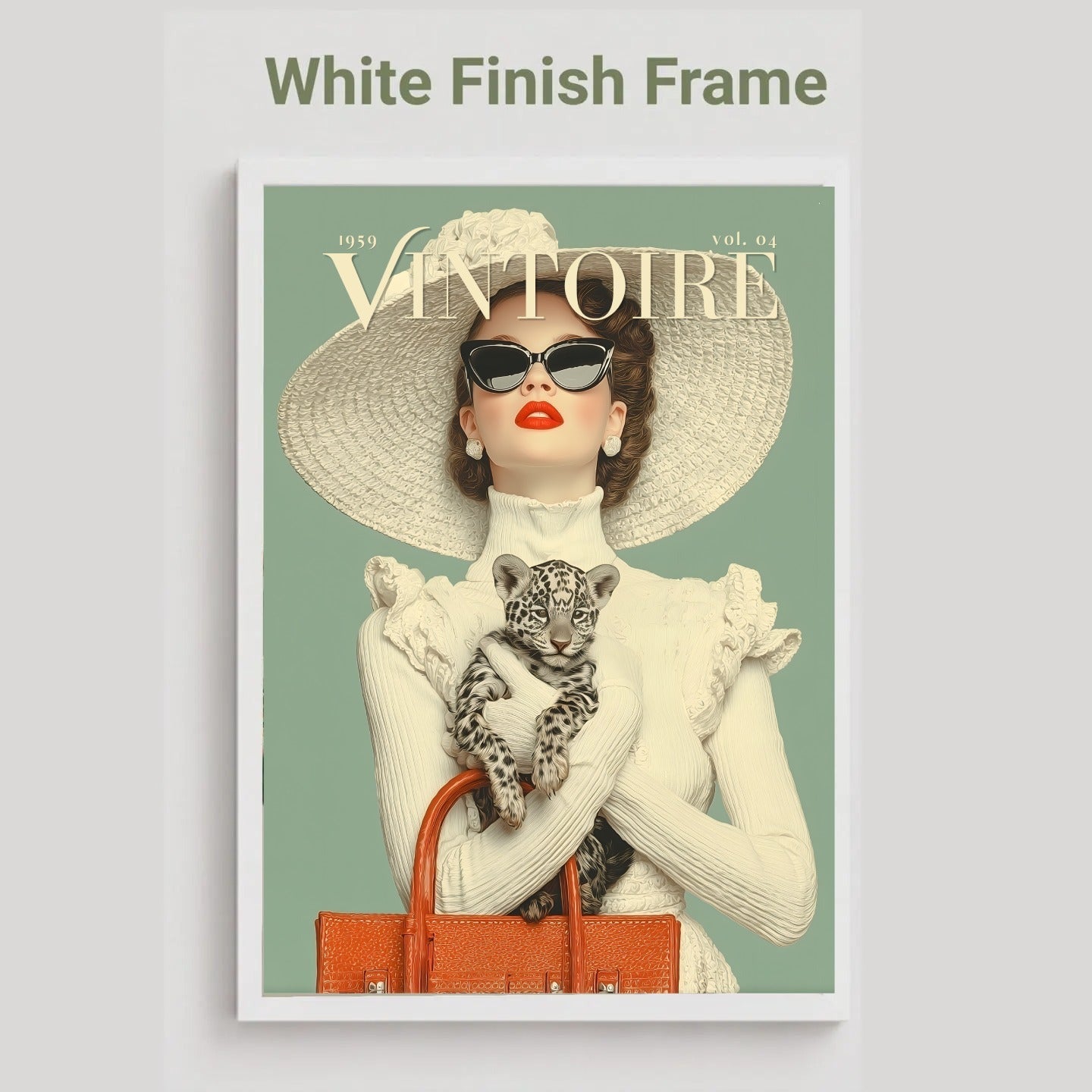 A framed art print featuring a vintage-style Vogue magazine cover illustration of a woman in a large straw hat holding a leopard cub, with an orange handbag, set against a muted sage green background. The print is displayed in a white frame on a light gray background with the text 'White Finish Frame' above it.