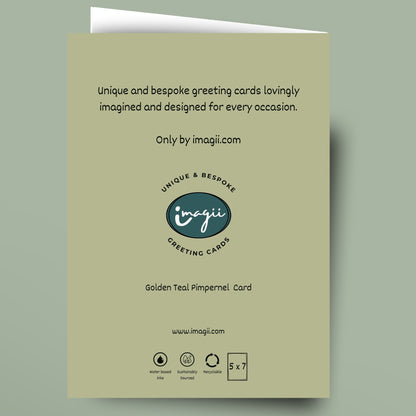 A greeting card shown flat against a muted sage green background. The card is a pale warm beige/olive tone with black text and a central logo reading 'inagi' and 'Greeting Cards.