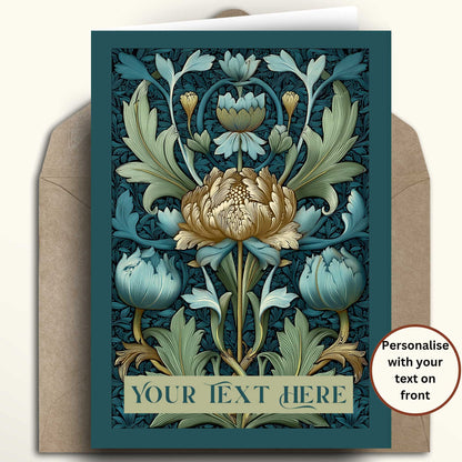 A floral greeting card with an Art Nouveau style design in teal, sage green, cream, and gold, shown with a brown envelope on a light beige background. A circular badge on the right says 'Personalise with your text on front'.