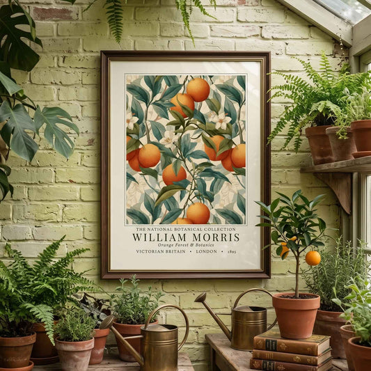 Greenhouse interior with plants, a watering can, and a framed botanical print on a brick wall.