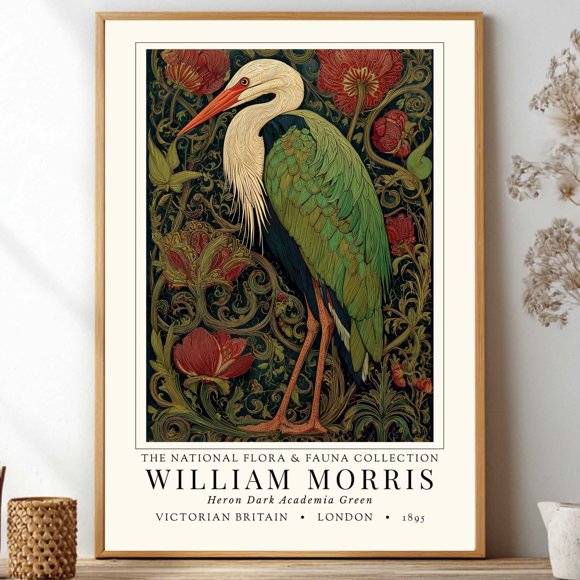 William Morris inspired heron exhibition poster in a jewel-toned palette of forest green, antique crimson and old gold, featuring a grey heron amid ornate pimpernel blooms and curling vines — Victorian Arts and Crafts style, framed print.