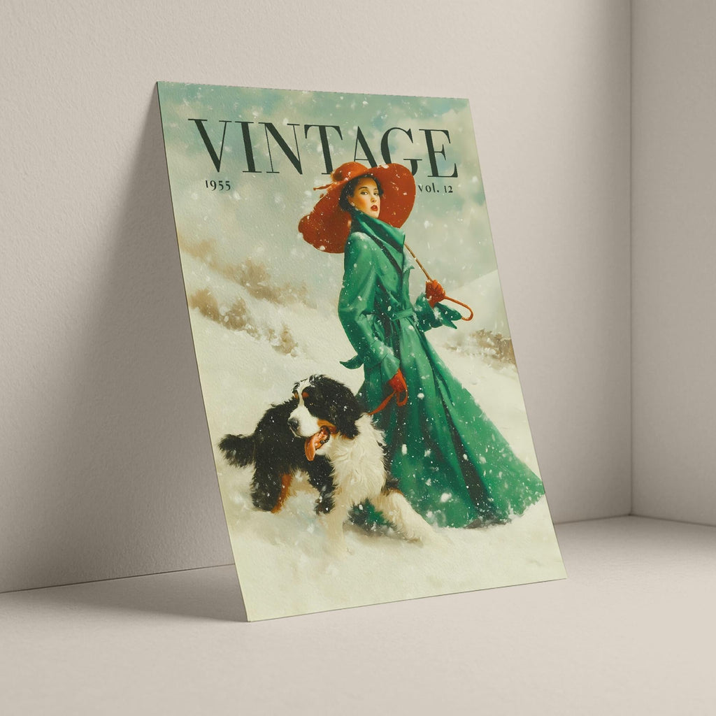 A vintage-style illustrated print leaning against a light gray wall in a minimalist room corner. The artwork shows a woman in a long green coat and red hat walking with a black-and-white dog in the snow, with the word 'VINTAGE' across the top.