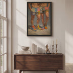 Video of the black-framed Cool Boys print hanging above a wooden sideboard in a sunlit room, showing two men in pastel patchwork COOL shorts and colourful retro trainers.