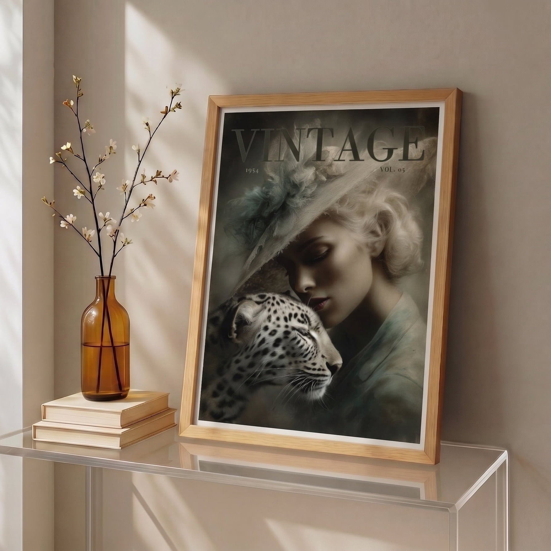 Framed vintage artwork of a woman with a leopard or cheetah on a glass table against a beige wall.