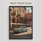 Framed artwork of a vintage car in an urban setting with 'Vintage' text.Vintage 1950s Porsche 911 classic car poster in a black frame on a white living room wall