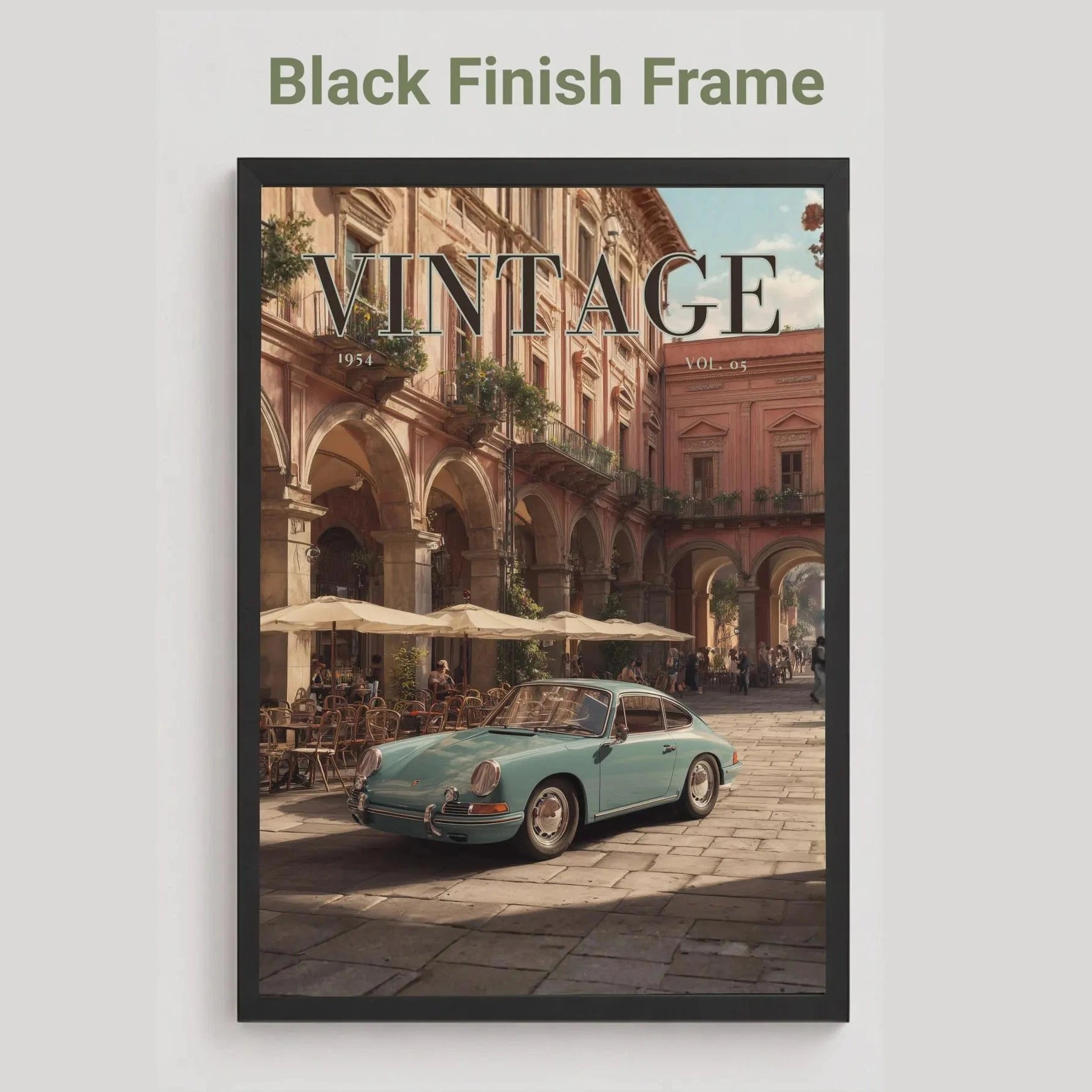 Framed artwork of a vintage car in an urban setting with 'Vintage' text.Vintage 1950s Porsche 911 classic car poster in a black frame on a white living room wall