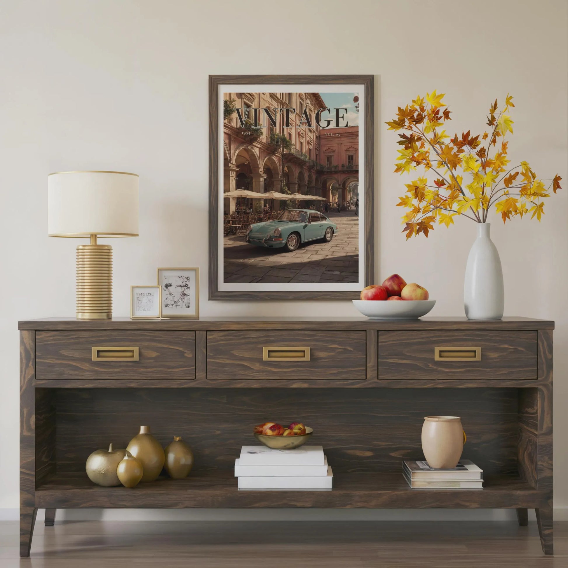 Wooden console table with decorative items including a lamp, framed picture, and vase with flowers.Vintage 1950s Porsche 911 classic car poster in a black frame on a white living room wall