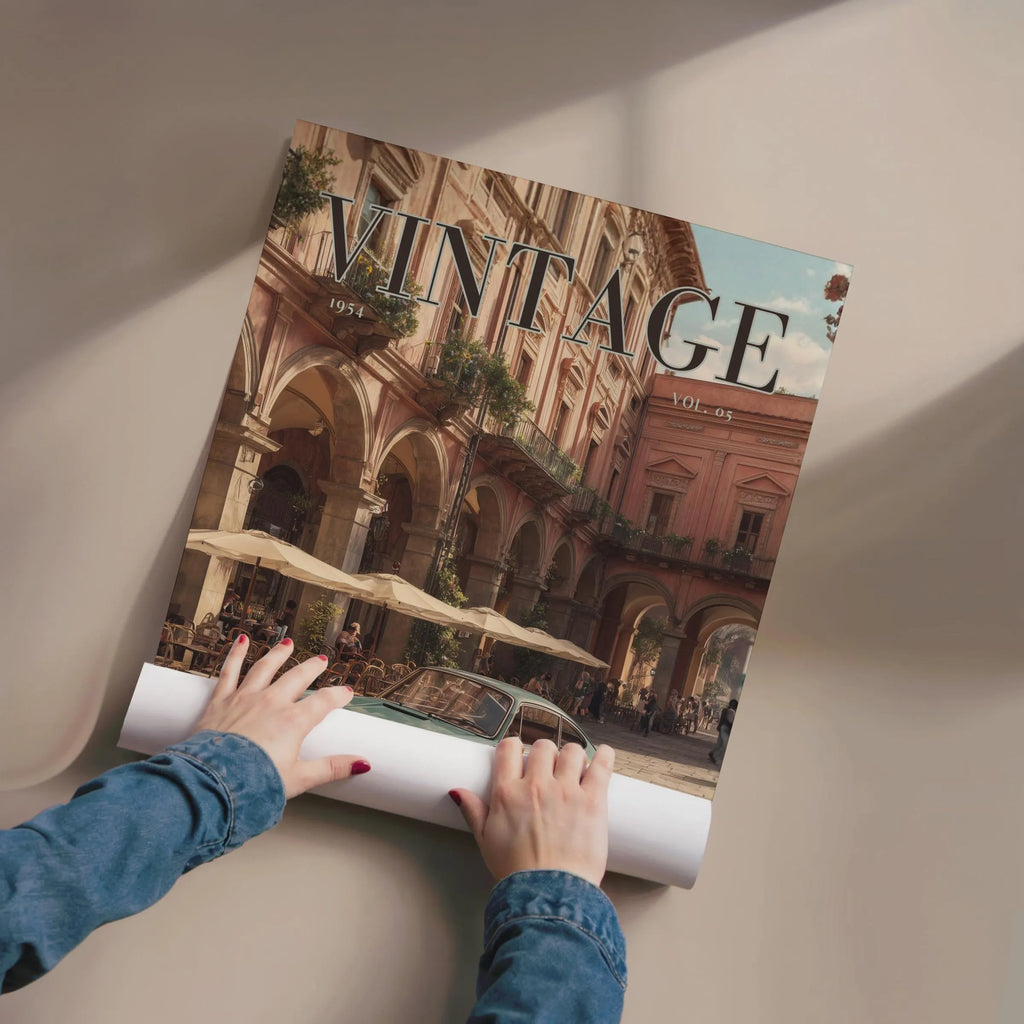 Person unrolling a large poster of a vintage city scene with 'VINTAGE' text.Vintage 1950s Porsche 911 classic car poster in a black frame on a white living room wall
