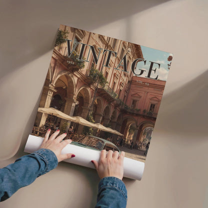 Person unrolling a large poster of a vintage city scene with 'VINTAGE' text.Vintage 1950s Porsche 911 classic car poster in a black frame on a white living room wall