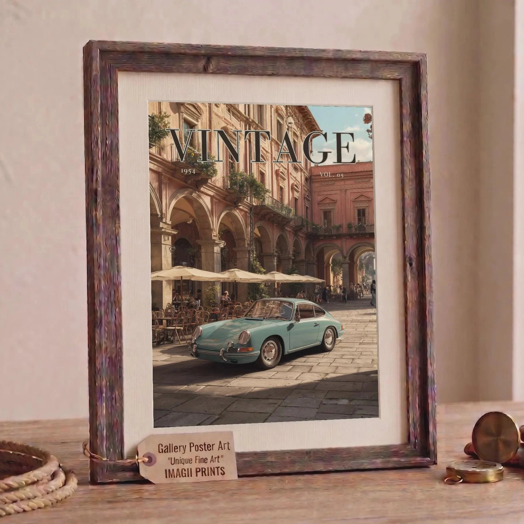 Framed artwork of a vintage car on a city street with 'Vintage' text, displayed on a wooden surface.Vintage 1950s Porsche 911 classic car poster in a black frame on a white living room wall